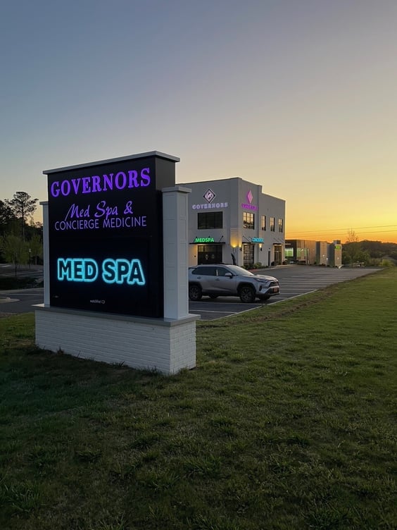 Changeable Color Light Cabinet with Digital Reader Board Monument Sign and Changeable Color Channel Letters in background